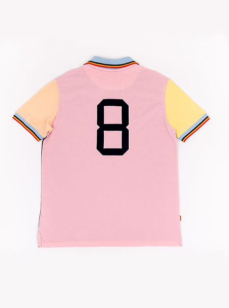Man wearing navy based multicoloured panelled 100% cotton polo shirt with giant number 8 on pale pink back.